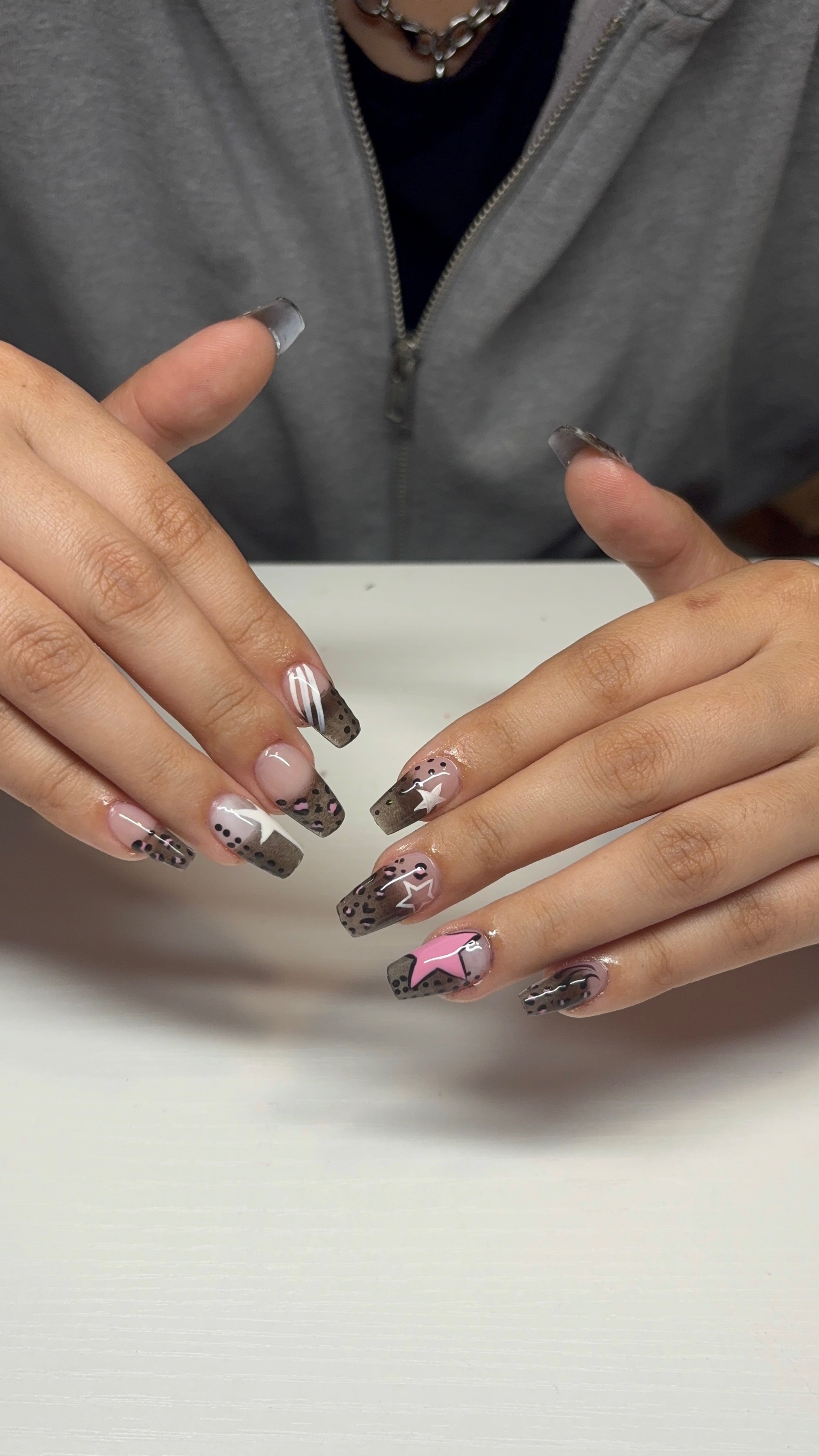 Brown leopard print nails with stars